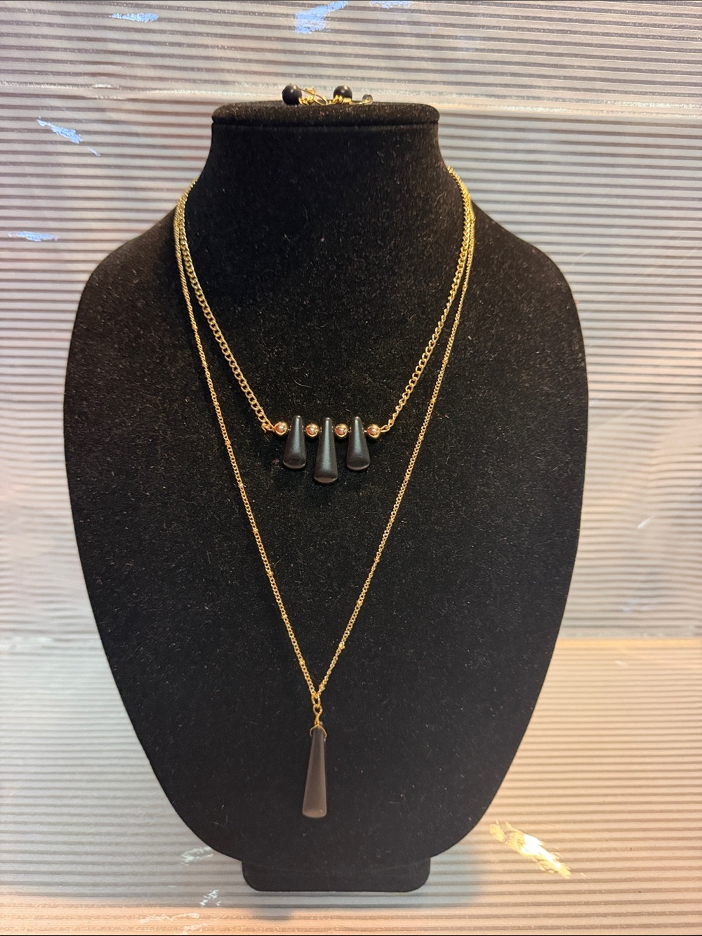 Gold-Tone Layered Necklace with Black Pendant Accents and matching earrings